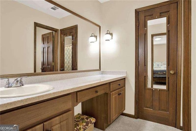 bathroom featuring visible vents and vanity