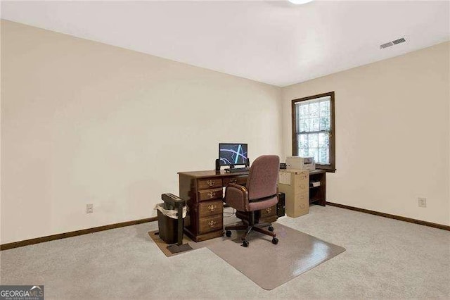 office area with carpet floors, visible vents, and baseboards