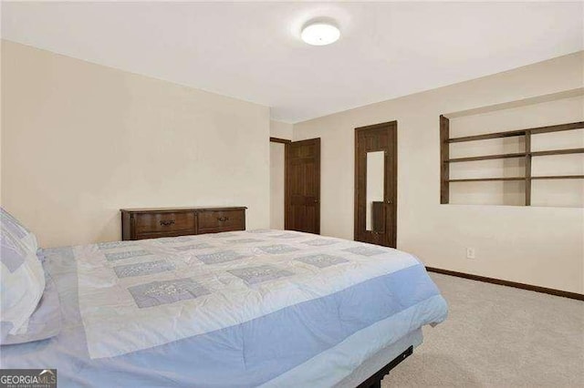 bedroom with carpet and baseboards