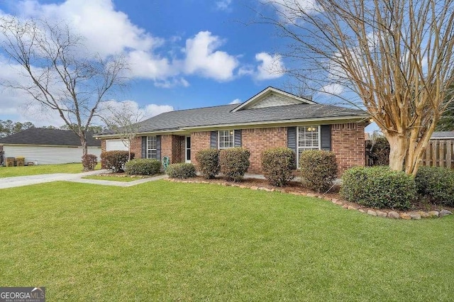 ranch-style home with driveway, an attached garage, fence, a front lawn, and brick siding