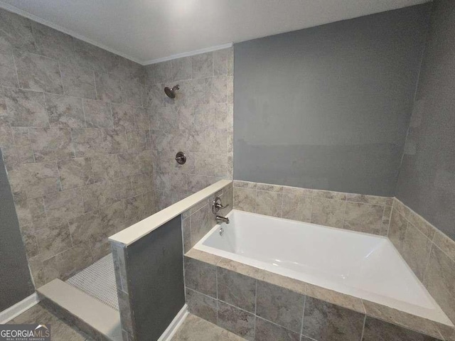 full bathroom featuring a garden tub and a tile shower