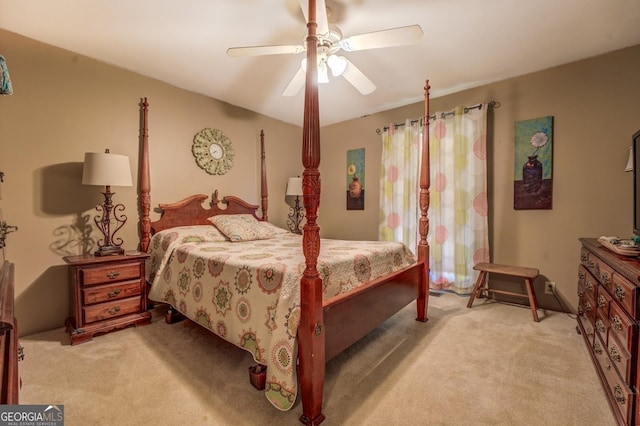 bedroom featuring a ceiling fan and light carpet