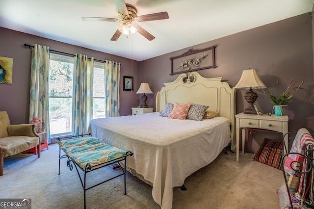 bedroom featuring a ceiling fan and light colored carpet