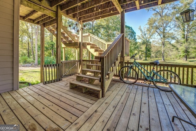 wooden terrace featuring stairs