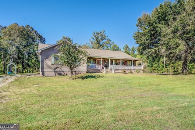 view of front of home featuring covered porch and a front lawn