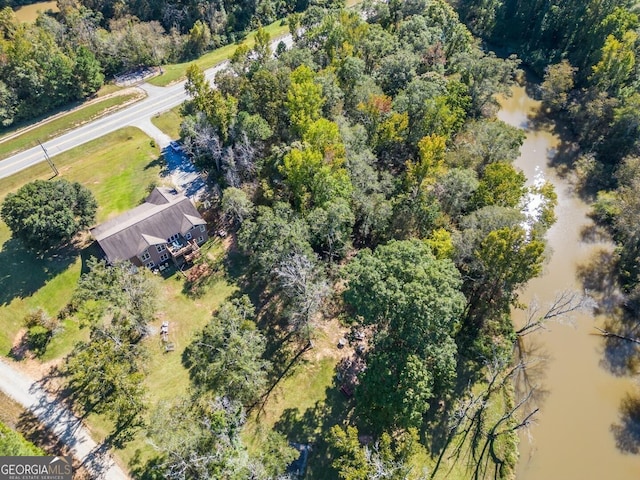 bird's eye view featuring a wooded view