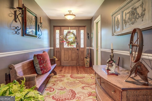 foyer entrance with light wood-style floors