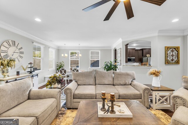 living area featuring light wood-type flooring, crown molding, and recessed lighting