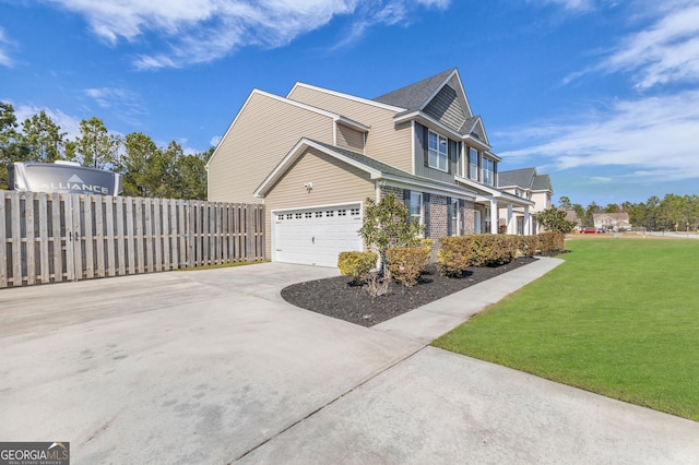 view of side of property featuring fence, a lawn, and concrete driveway