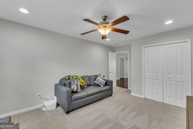 living area featuring carpet, baseboards, and recessed lighting