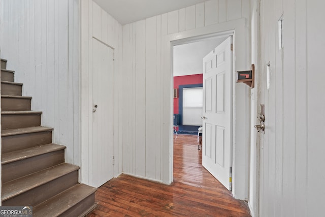 hallway featuring stairway and hardwood / wood-style floors