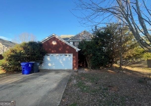 garage with concrete driveway