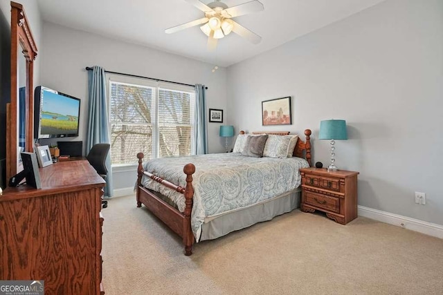 bedroom featuring ceiling fan, baseboards, and light colored carpet