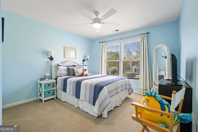 bedroom with baseboards, visible vents, ceiling fan, and light colored carpet