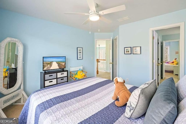 carpeted bedroom with ceiling fan