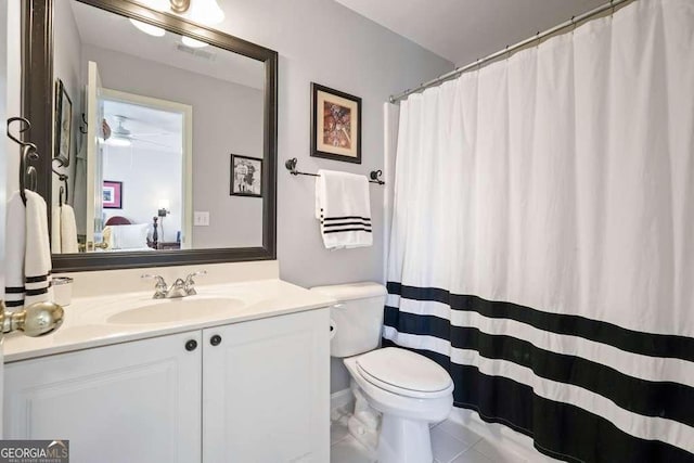 bathroom featuring toilet, tile patterned floors, visible vents, and vanity