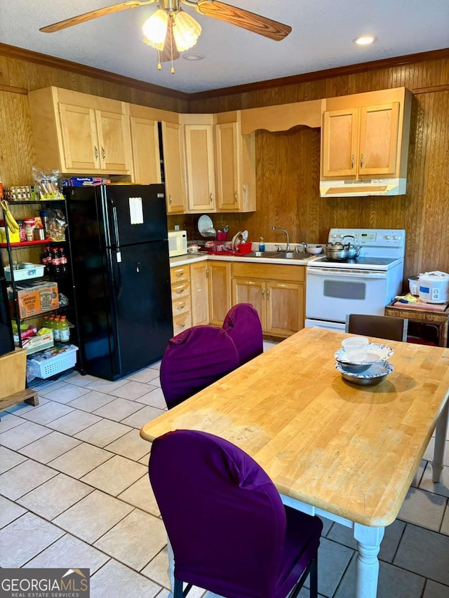 kitchen featuring ornamental molding, wooden walls, white appliances, and under cabinet range hood