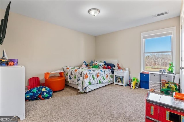 bedroom with carpet floors and visible vents