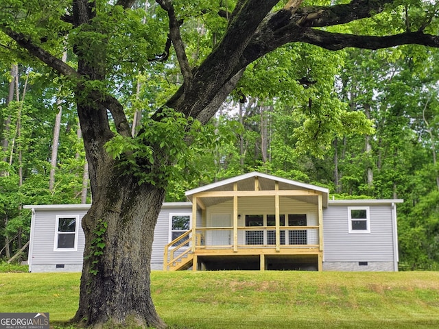 2859 Fortner Rd, Ball Ground, GA 30107 - back of property with crawl space, a yard, and covered porch
