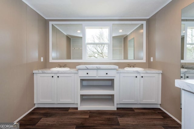 2859 Fortner Rd, Ball Ground, GA 30107 - bathroom featuring two vanities, wood finished floors, and recessed lighting