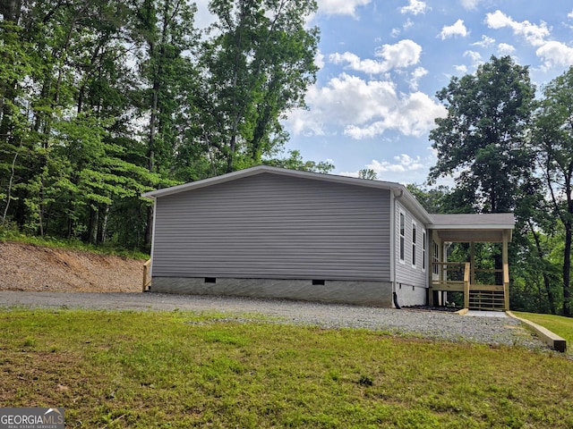 2859 Fortner Rd, Ball Ground, GA 30107 - view of property exterior featuring crawl space, a lawn, and a wooden deck