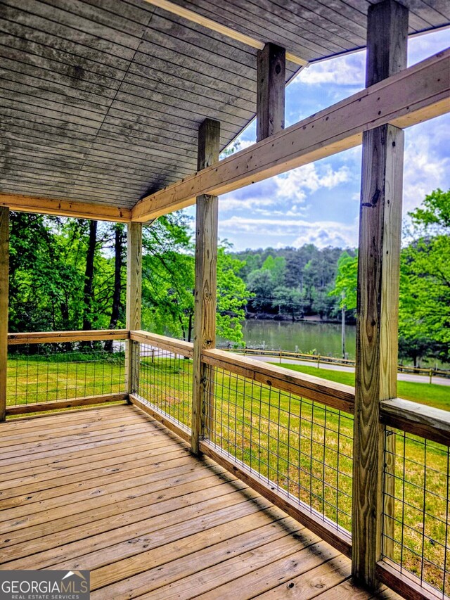 2859 Fortner Rd, Ball Ground, GA 30107 - wooden deck featuring a water view, a lawn, and view of wooded area