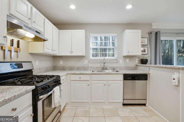 455 Registry Blf, Stone Mountain, GA 30087 - kitchen with stainless steel appliances, under cabinet range hood, a sink, light tile patterned floors, and white cabinets