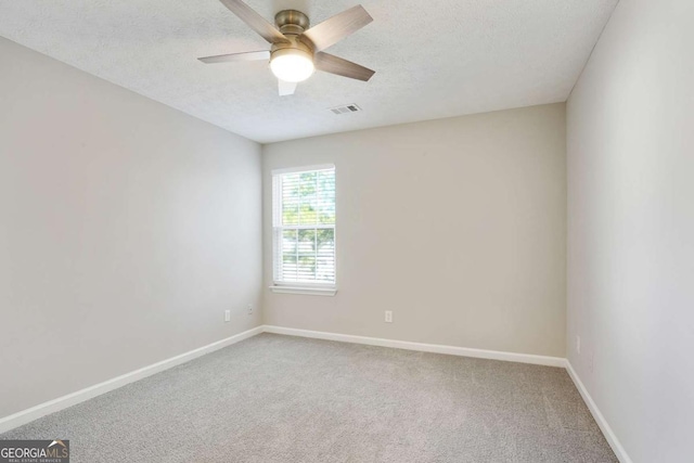 455 Registry Blf, Stone Mountain, GA 30087 - carpeted empty room with a ceiling fan, baseboards, and a textured ceiling