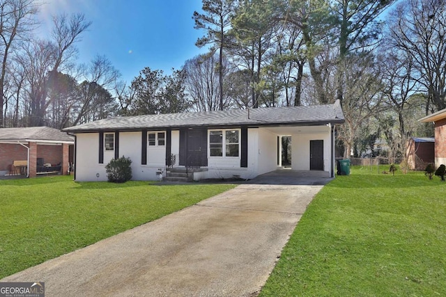 ranch-style home featuring a carport, a front lawn, concrete driveway, and stucco siding