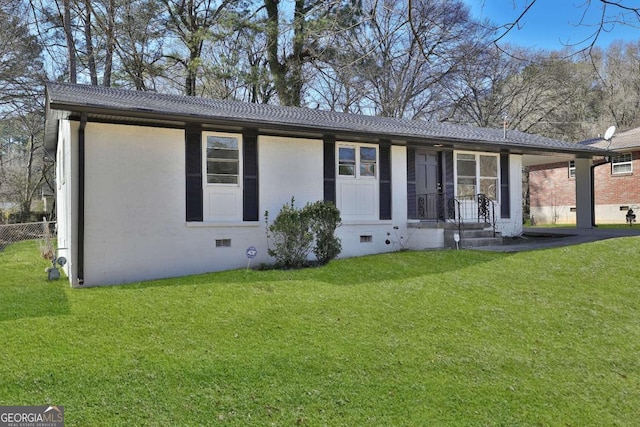 single story home featuring crawl space, fence, and a front lawn