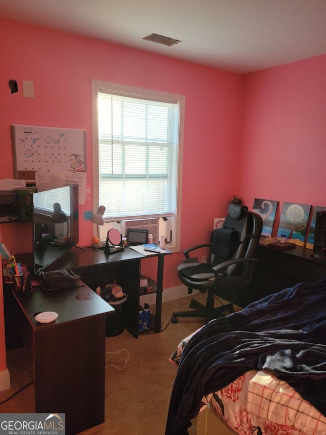 carpeted bedroom featuring visible vents