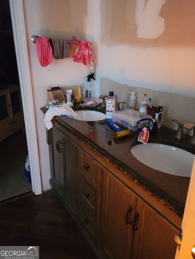 bathroom featuring double vanity and a sink