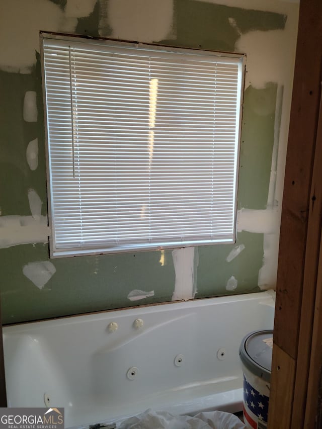 bathroom with a whirlpool tub