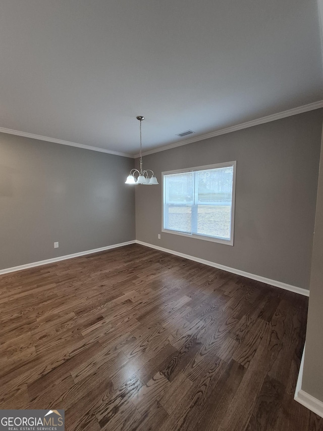 unfurnished dining area featuring dark wood finished floors, visible vents, a notable chandelier, and baseboards