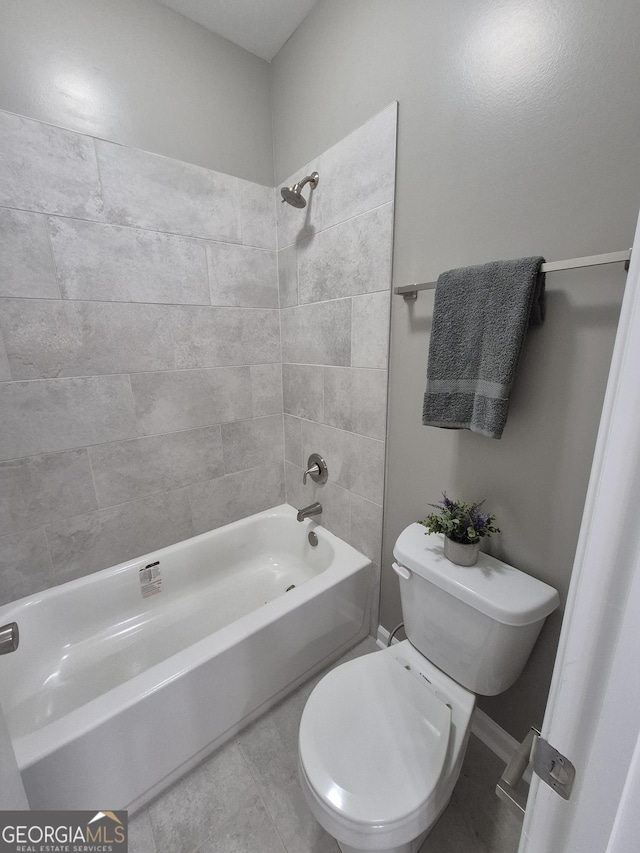 full bath with shower / bathing tub combination, toilet, and tile patterned floors