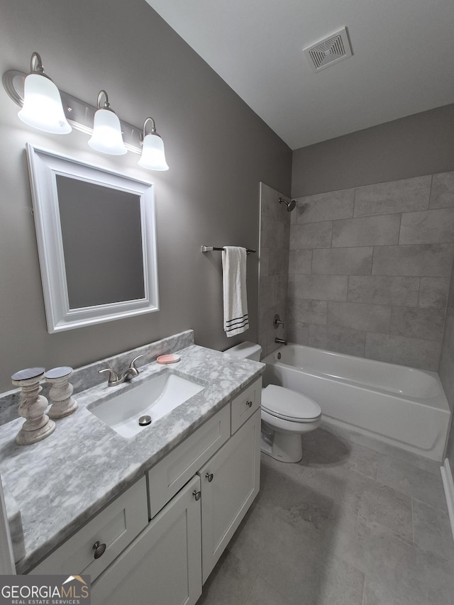 bathroom with toilet, vanity, visible vents, and shower / bathing tub combination