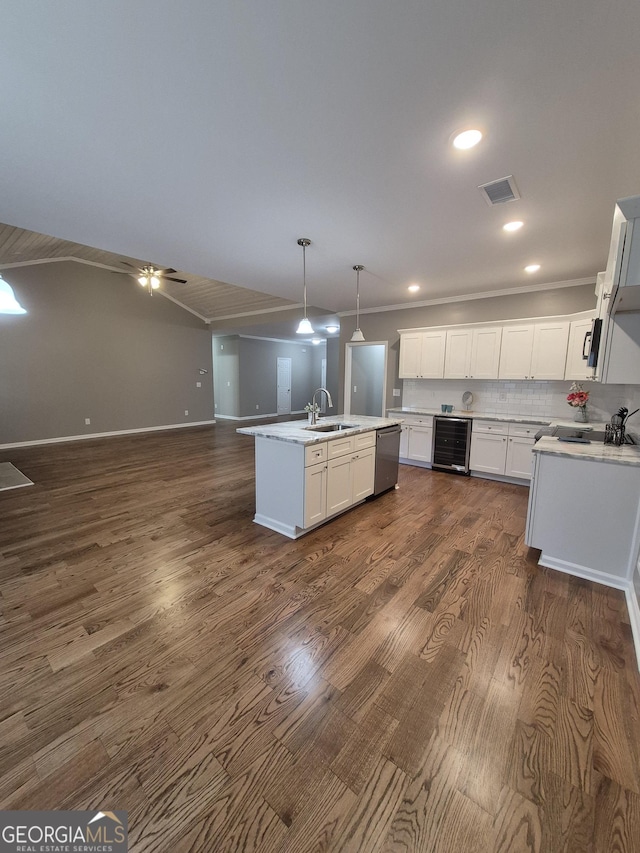 kitchen featuring visible vents, wine cooler, dark wood-type flooring, a sink, and stainless steel dishwasher