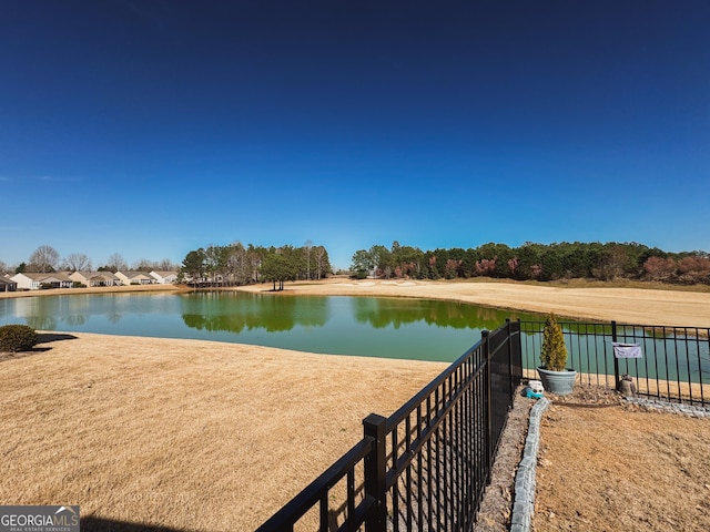 water view featuring fence