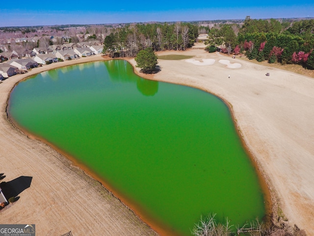 birds eye view of property with a water view and a residential view