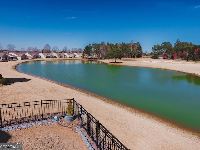 water view featuring fence and a residential view
