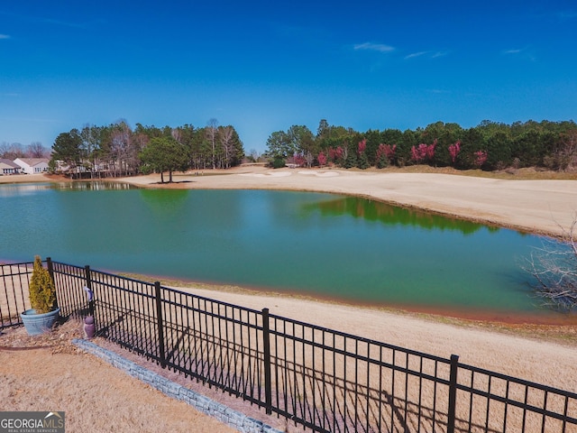 view of water feature featuring fence