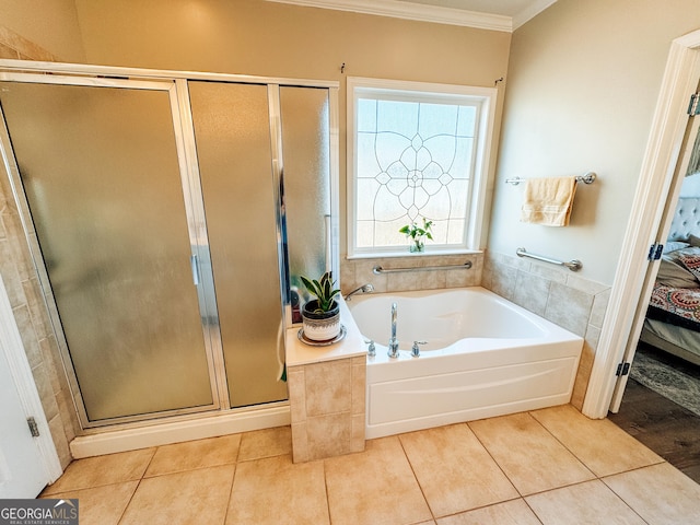 ensuite bathroom featuring tile patterned floors, crown molding, a shower stall, and ensuite bathroom