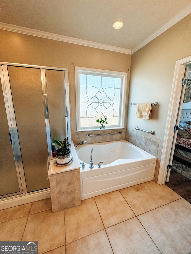 bathroom featuring ornamental molding, a shower stall, a bath, and tile patterned floors
