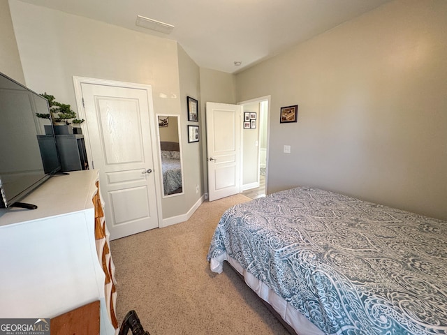 bedroom featuring light carpet