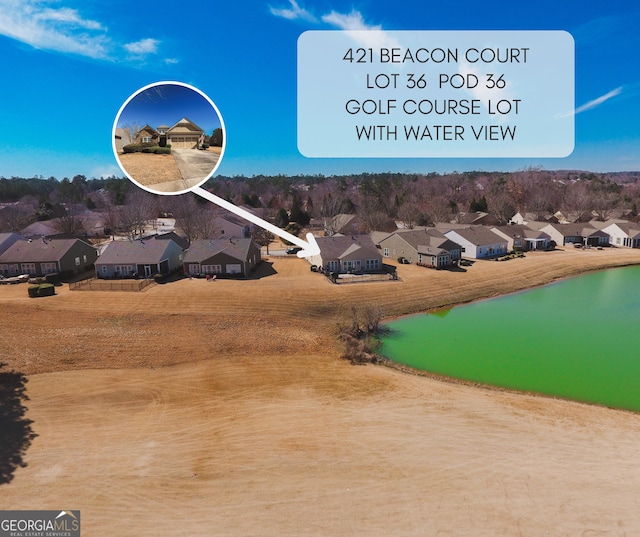 bird's eye view featuring a residential view and a water view