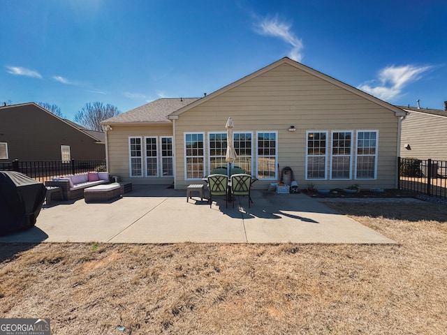 back of house featuring a patio, fence, and an outdoor living space