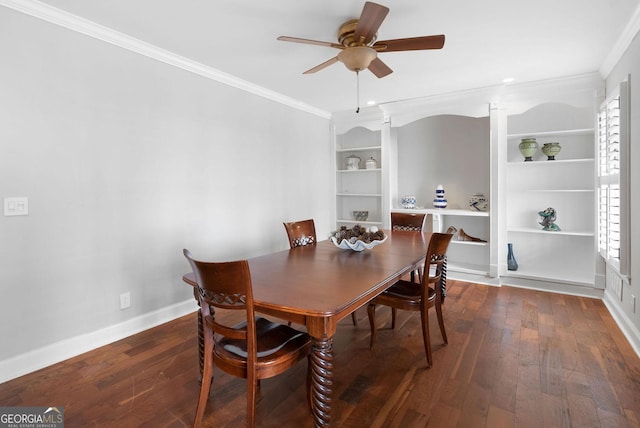 dining space with ceiling fan, built in shelves, baseboards, dark wood finished floors, and crown molding