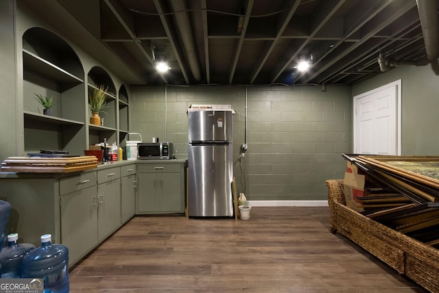 kitchen with stainless steel appliances, gray cabinets, and dark wood-style floors