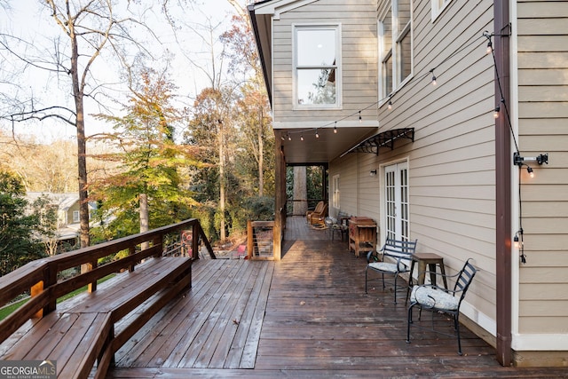 wooden deck featuring french doors