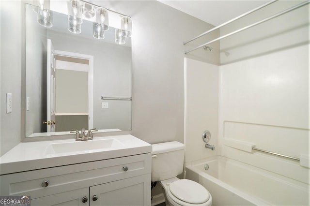 bathroom with shower / washtub combination, vanity, and toilet